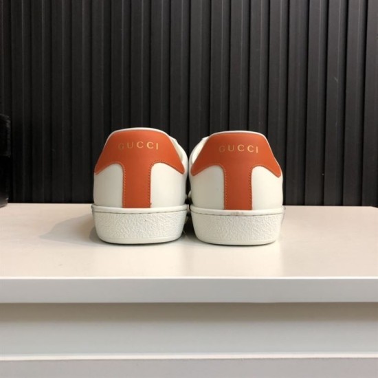 Gucci Ace Disney Mickey Mouse Trainers Heel View in ivory and orange Rear view of Gucci Ace Disney Mickey Mouse trainers displaying orange heel tabs with logo detail in ivory and orange