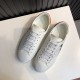 Gucci Ace Disney Mickey Mouse Ivory Trainers Overhead View in ivory and orange Overhead view of Gucci Ace Disney Mickey Mouse ivory trainers detailing white laces and upper construction in ivory and orange