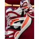 Gucci Basket High-Top Trainer Side Panel Detail in red and white Detailed side view of the cage overlays and fluorescent orange heel trim on Gucci Basket trainer in red and white