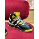 Front quarter angle of Gucci Basket High-Top Trainer in black and yellow