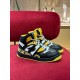 Pair of Gucci Basket High-Top Trainers in black and yellow on display