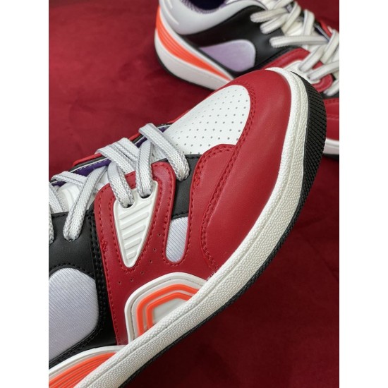 Detailed view of the red leather overlays and stitching on the Gucci Basket trainer toe box in multicolour and red