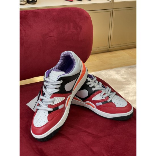 Front oblique view showing the lace-up closure and perforated toe box of the Gucci Basket trainer in multicolour and red