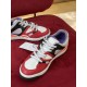 Top-down view of Gucci Basket trainers showing the white and red upper panelling in multicolour and red