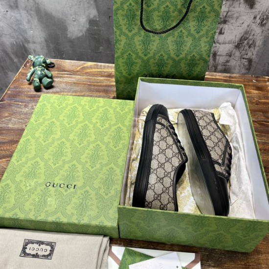 Gucci Low Top Trainers Unboxed in beige and black Gucci GG Monogram Canvas Low Top Trainers stored inside the patterned green shoe box in beige and black