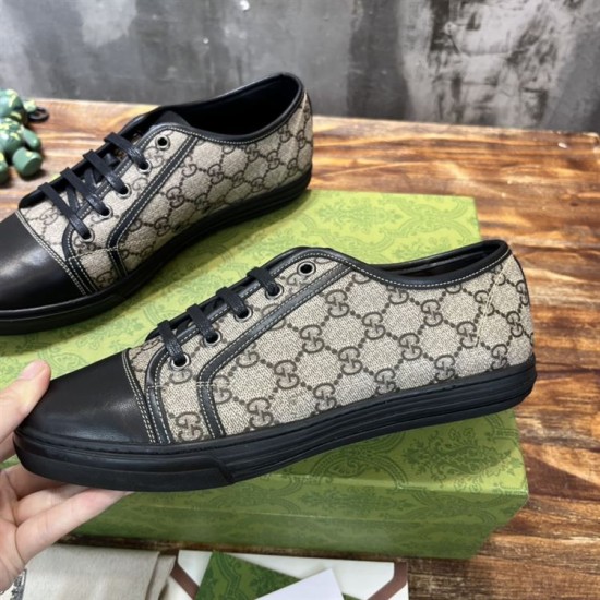 Gucci GG Monogram Canvas Trainer Profile in beige and black Close-up profile of the beige GG canvas and black leather details on the low-top trainer.