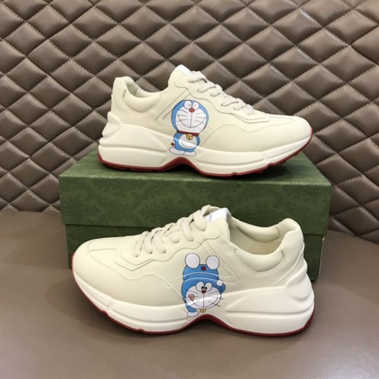 Gucci Rhyton Ivory Trainers Graphic Side View in ivory and red Pair of Gucci Rhyton ivory trainers displaying outer and inner character print graphics in ivory and red