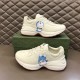 Gucci Rhyton Ivory Trainers Graphic Side View in ivory and red Pair of Gucci Rhyton ivory trainers displaying outer and inner character print graphics in ivory and red