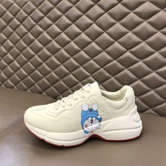 Gucci Rhyton Ivory Trainer Alternate Character in ivory and red Gucci Rhyton ivory trainer on display showing alternate character graphic on lateral side in ivory and red