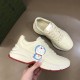 Gucci Rhyton Ivory Trainers Dynamic Angle in ivory and red Gucci Rhyton trainer pair shown in dynamic arrangement highlighting leather finish and graphics in ivory and red