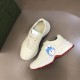 Gucci Rhyton Ivory Leather Trainers Pair Overview in ivory and red Overhead pair view showing top and side angles of Gucci Rhyton ivory leather trainers in ivory and red