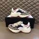 Gucci Rhyton Leather Trainers Pair Display in beige and pink Pair of Gucci Rhyton chunky trainers displayed on and in front of a shoe box in beige and pink