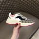 Gucci Rhyton Trainer Inner Profile View in beige and pink Hand holding Gucci Rhyton chunky trainer showing inner side panel in beige and pink