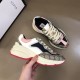 Gucci Rhyton Trainer Overhead Angle in beige and pink Overhead view of Gucci Rhyton trainer resting on leather surface in beige and pink