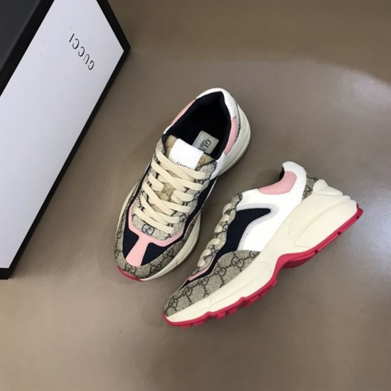 Gucci Rhyton GG Canvas Trainers Pair Angle in beige and pink Angled top-down view of pair of Gucci Rhyton trainers next to brand box in beige and pink