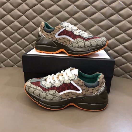 Gucci GG Rhyton Low Top Trainers Pair on Box in beige and brown Pair of Gucci GG Rhyton Monogram Canvas Low Top Trainers displayed on a shoebox in beige and brown