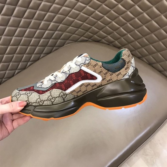 Gucci GG Rhyton Low Top Trainer Medial Profile in beige and brown Medial side view of Gucci GG Rhyton Monogram Canvas Low Top Trainer showing dark brown midsole in beige and brown
