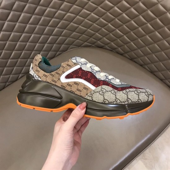 Gucci GG Rhyton Low Top Trainer Lateral Profile in beige and brown Lateral side view of beige brown Gucci GG Rhyton Monogram Canvas Low Top Trainer held up