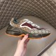 Gucci GG Rhyton Low Top Trainer Lateral Profile in beige and brown Lateral side view of beige brown Gucci GG Rhyton Monogram Canvas Low Top Trainer held up