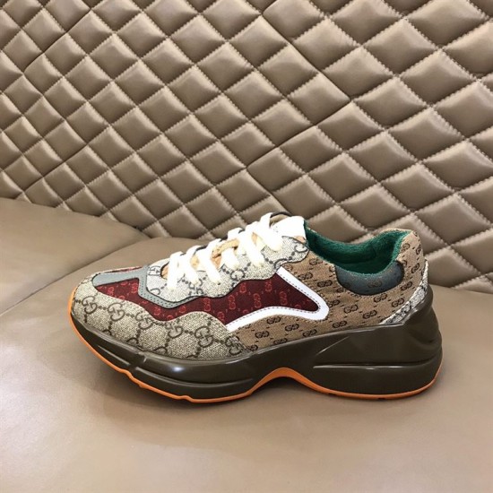 Gucci GG Rhyton Low Top Trainer Side View in beige and brown Side elevation of Gucci GG Rhyton Monogram Canvas Low Top Trainer resting on cushion in beige and brown