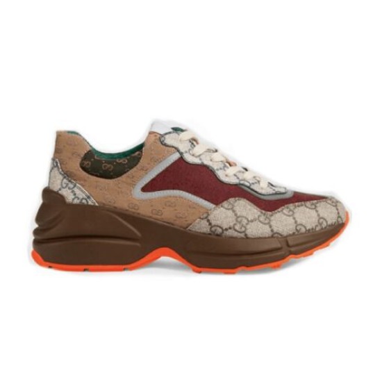 Gucci GG Rhyton Low Top Trainer Isolated Profile in beige and brown Full lateral side view of Gucci GG Rhyton Monogram Canvas Low Top Trainer on white background in beige and brown