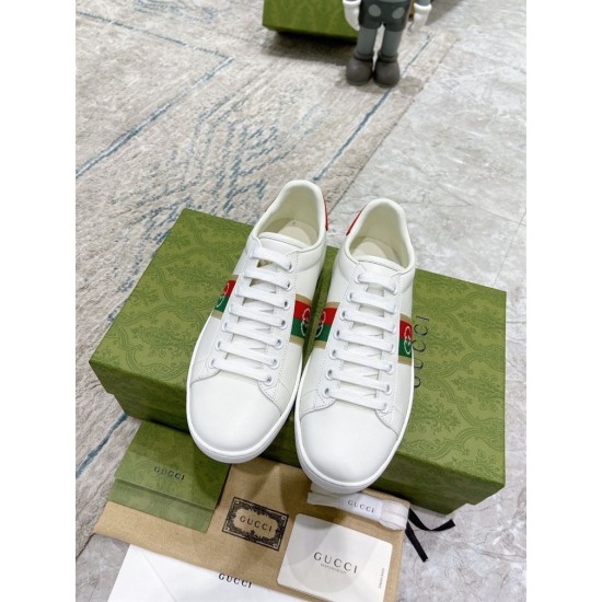 Pair View of Gucci Interlocking G White Leather Trainers in white and red Top-down pair view of white Gucci trainers with lace-up front and green web detail in white and red