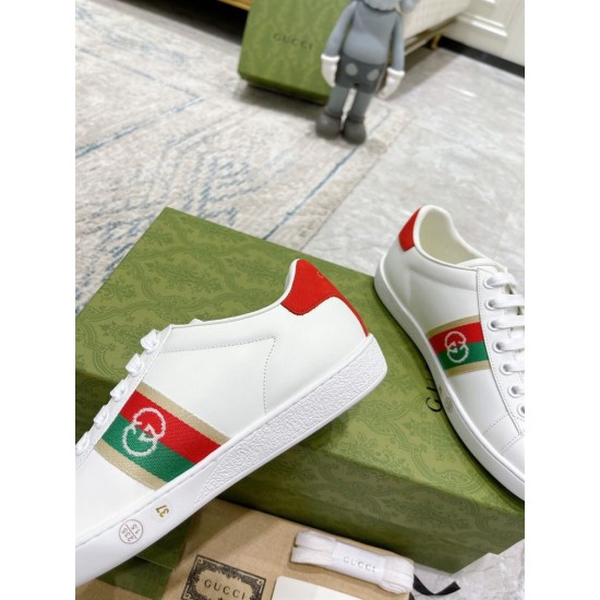 Gucci White Leather Trainer Side Detail in white and red Side profile close-up of Gucci white leather trainer showing stitched sole and side panel in white and red