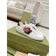 Gucci White Leather Trainers Box Set in white and green Pair of Gucci white leather apple trainers displayed on patterned green shoebox