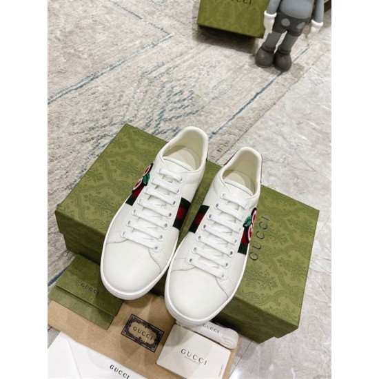 Gucci White Leather Trainers Top View in white and green Top-down view of Gucci white leather trainers with laces and brand packaging in white and green