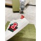 Gucci White Leather Trainer Apple Patch Close-up in white and green Close-up of embroidered GG apple patch on white leather Gucci trainer in white and green
