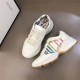 Gucci Rhyton Trainers Pair Overhead View in ivory Angled top view of a pair of Gucci Rhyton trainers in ivory