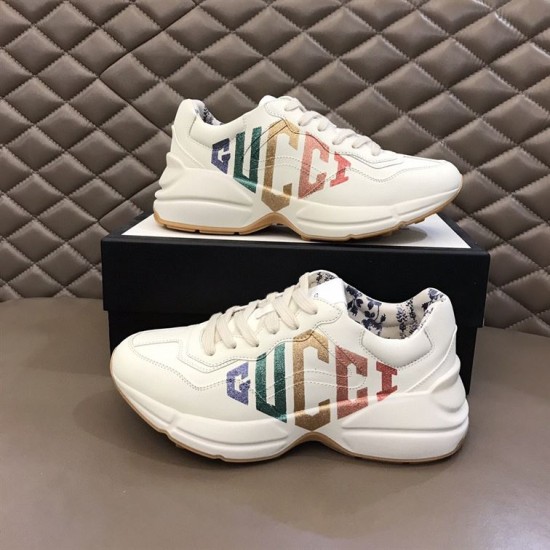 Gucci Rhyton Ivory Trainers Pair Profile Pair of Gucci Rhyton ivory trainers displayed beside shoebox