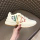 Gucci Rhyton Trainer Lateral Profile in ivory Handheld lateral view of Gucci Rhyton trainer with rainbow glitter print in ivory
