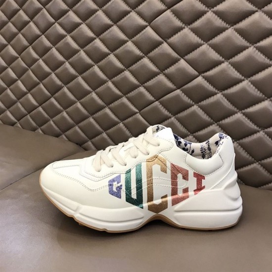 Gucci Rhyton Trainer Profile View in ivory Side profile of Gucci Rhyton trainer resting on display surface in ivory