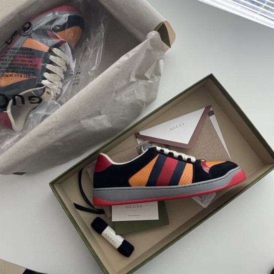 Gucci Screener Trainers In Black Suede And Orange Packaging Gucci Screener trainer in black suede and orange presented inside its product box.