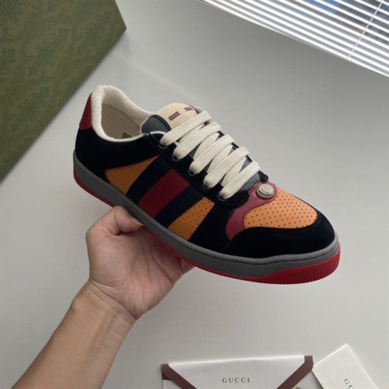 Gucci Screener Trainers In Black Suede And Orange Handheld View Handheld angled view highlighting the perforated orange toe box and grey midsole in black and orange