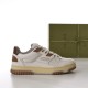 Lateral view of off-white Gucci trainer with brown eyelet accents