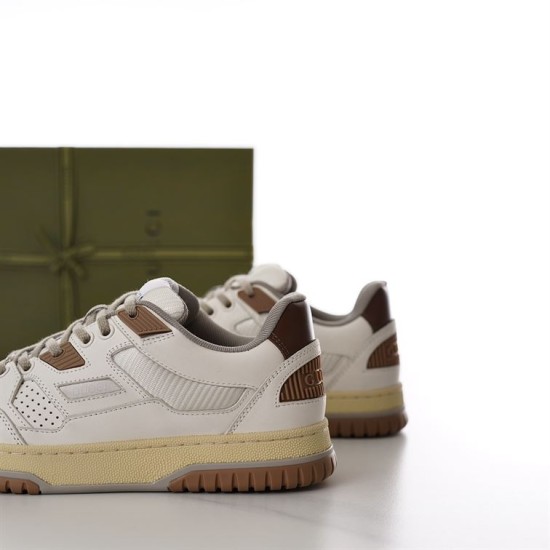 Side profile showing the heel counter and sole of off-white Gucci trainer in off-white and brown