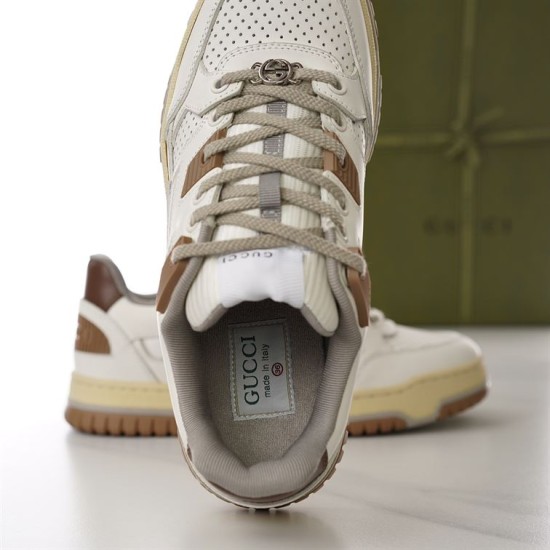 Top-down view inside the padded opening and footbed of off-white Gucci trainer in off-white and brown