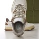 Top-down view inside the padded opening and footbed of off-white Gucci trainer in off-white and brown