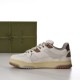 Medial side profile view of off-white and brown Gucci low-top trainer