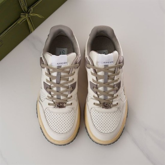 Gucci Off White Leather Trainers Top-Down View in off-white and grey Top-down view of Gucci off-white leather trainers highlighting grey laces and perforated toe boxes