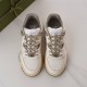 Gucci Off White Leather Trainers Top-Down View in off-white and grey Top-down view of Gucci off-white leather trainers highlighting grey laces and perforated toe boxes