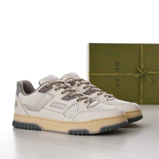 Gucci Off White Panelled Trainers Front Three-Quarter View in off-white and grey Angled pair view of Gucci off-white panelled trainers with grey details and branded green box