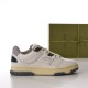 Gucci Off-White Trainer Lateral View in off-white and beige Lateral side view of the Gucci low-top trainer isolated against a studio background in off-white and beige