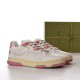 Gucci Low Top Off White Pink Panel Trainers Pair View Three-quarter view of Gucci Low Top Off White Pink Panel Trainers with green shoebox in the background