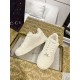 Gucci white low-top trainers placed inside luxury shoe box