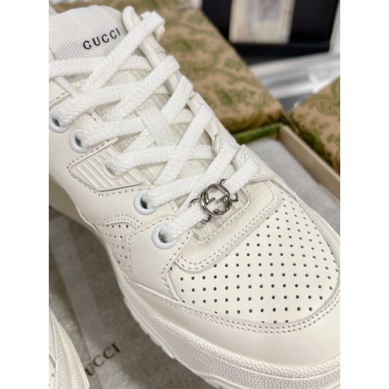 Detailed view of silver-tone lace dubrae on Gucci white trainer