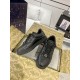 Top-down view of black Gucci low top trainers inside packaging box