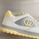 Close-up of side panel detailing on Gucci Mac80 trainers featuring the Interlocking G patch in white and grey